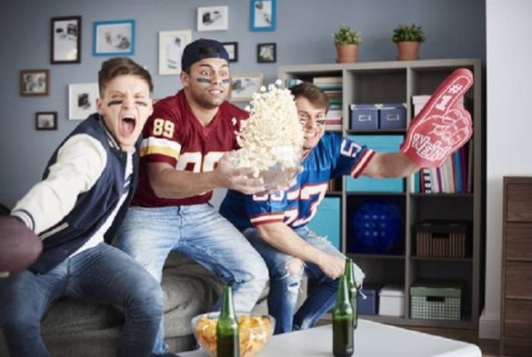Fans watching the Super Bowl game in their living room